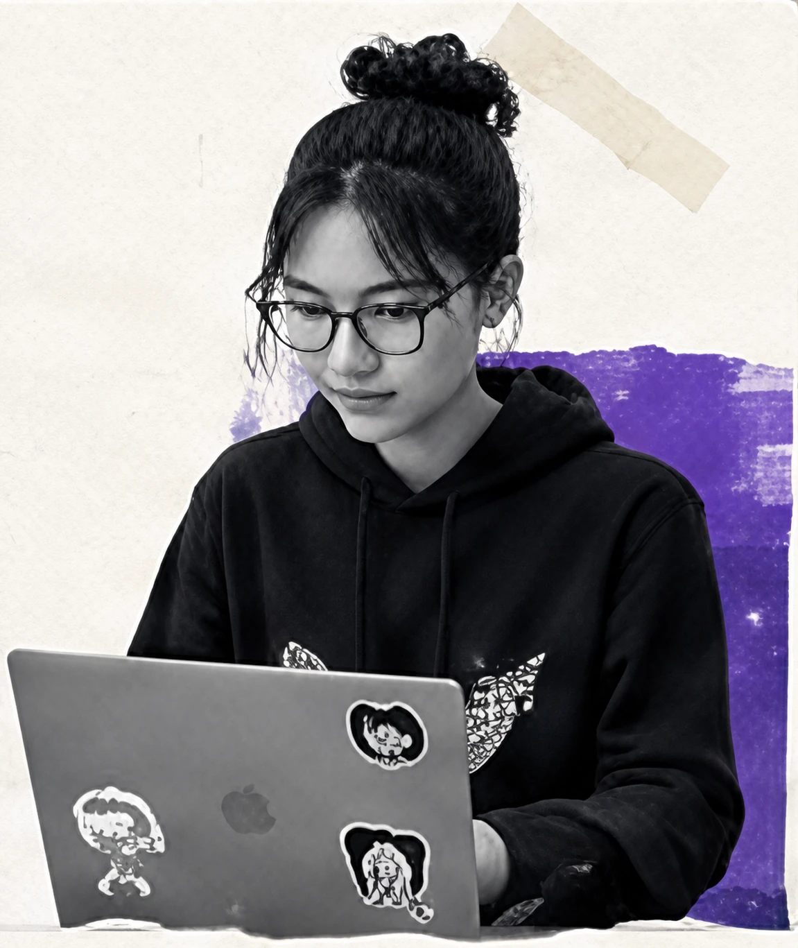 Developer with glasses working on a laptop